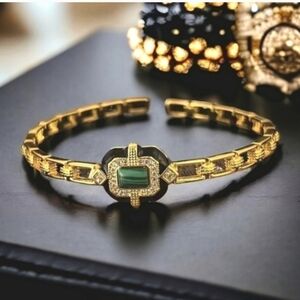 Gold Tone Bracelet with Green Stone Accent
